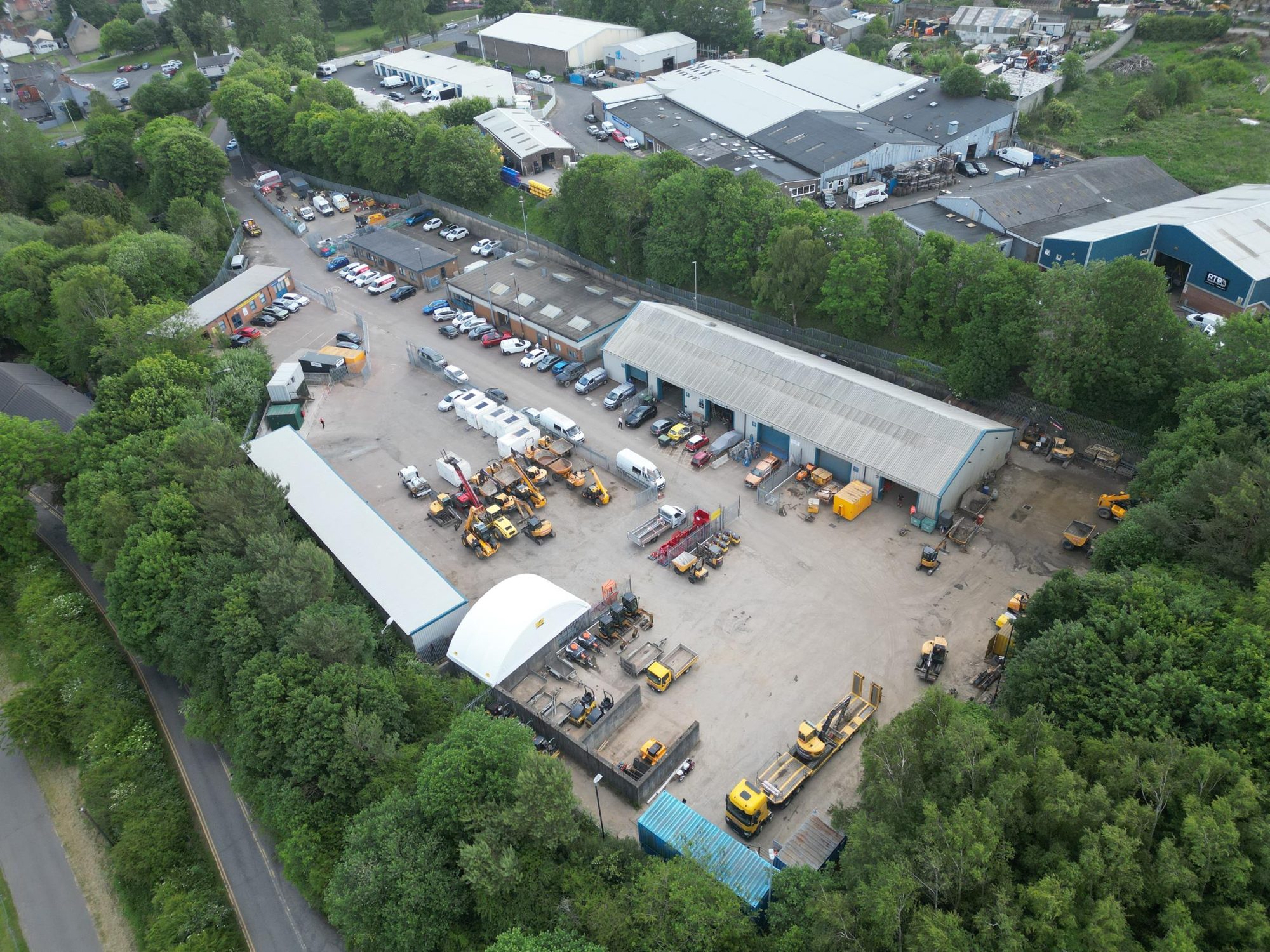 Aerial view of Metropolitan Industrial Park and its yard, surrounded by trees
